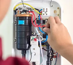 technician fixing water heater