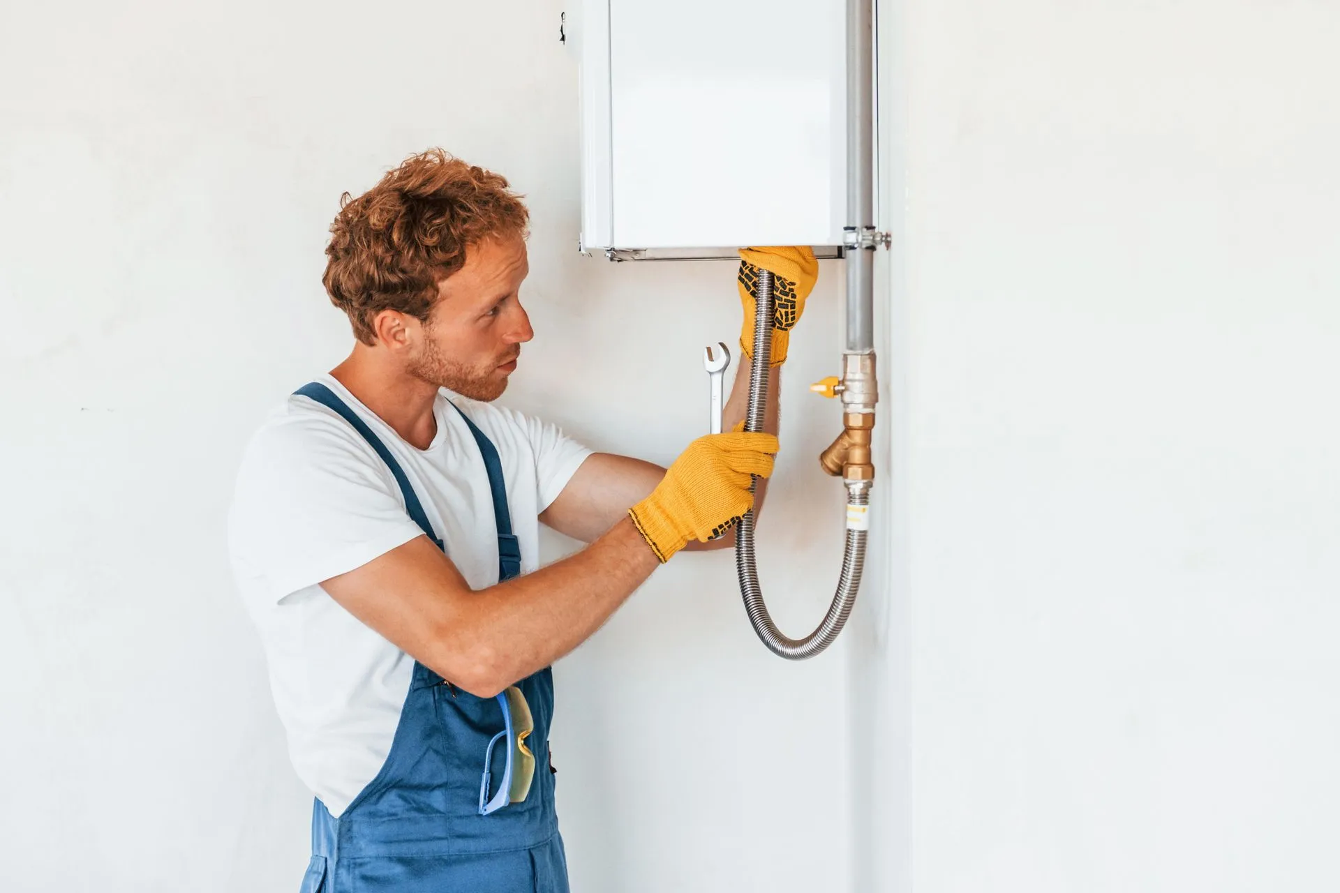  A technician installing a tankless water heater, demonstrating necessary adjustments like gas line modifications and proper ventilation. The image underscores the initial investment and long-term savings of tankless systems, with Water Heater Repair McKinney, TX providing competitive pricing and thorough estimates.